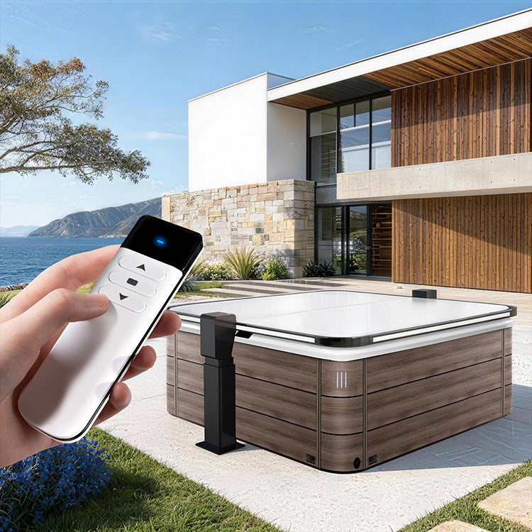 Person controlling a hot tub with a remote in front of a modern house with ocean views.