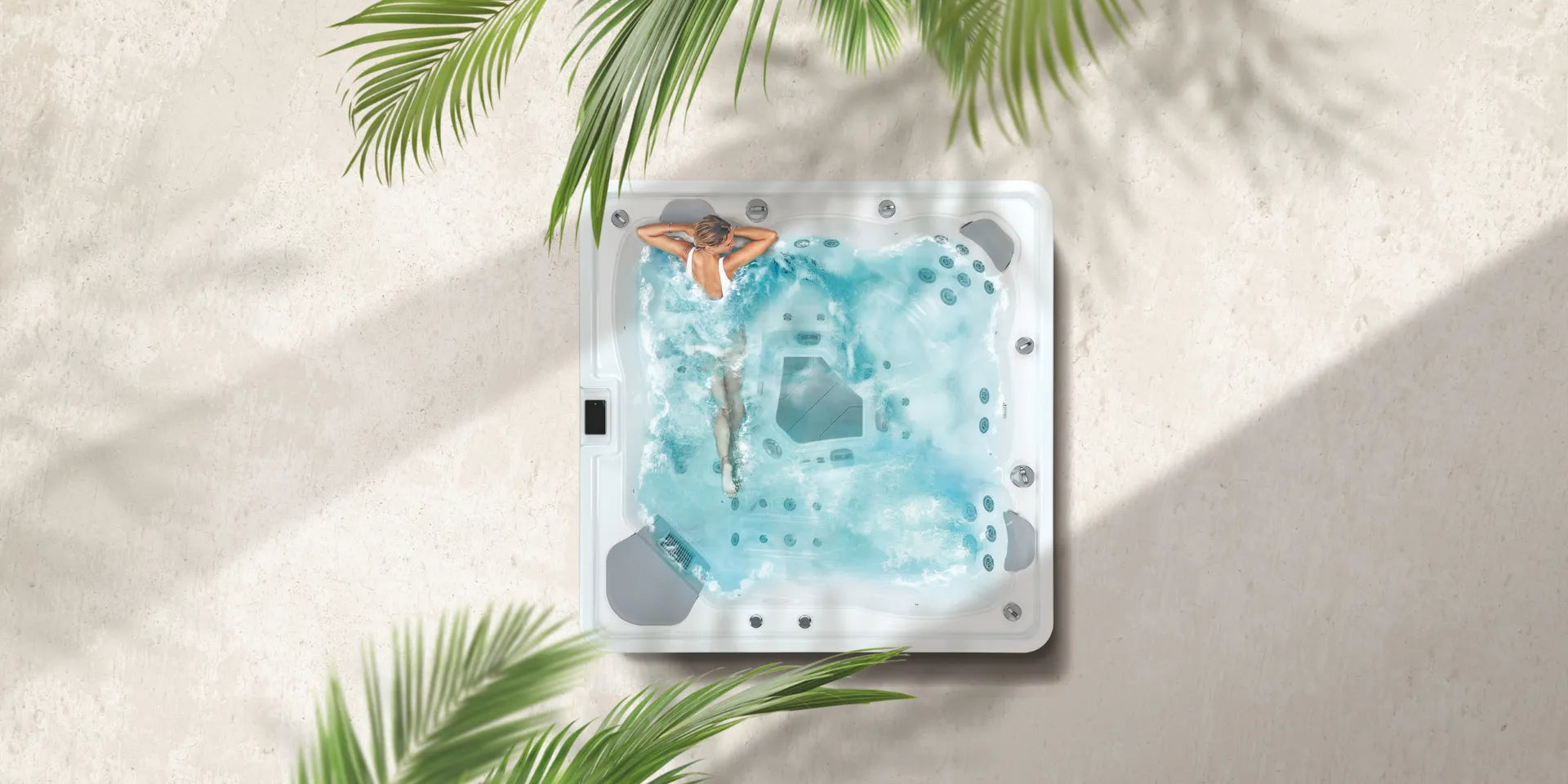 Hot tub with water design featuring a person underwater, surrounded by palm leaves