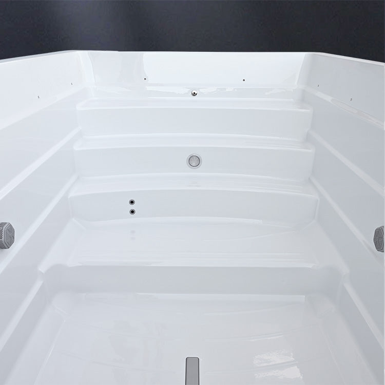Close-up of a white exercise swim spa with steps and on dark background