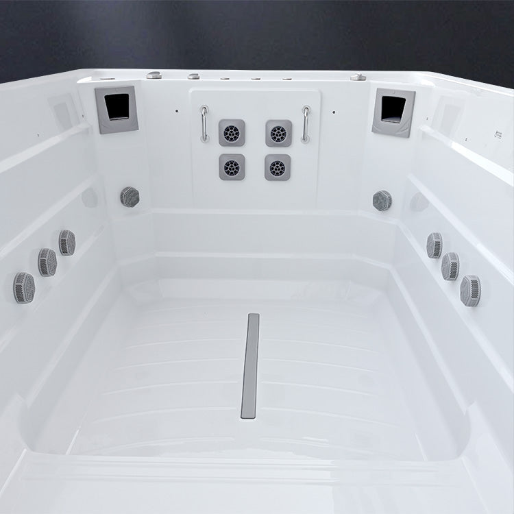 White exercise swim spa with 4 swimming jets on a dark background