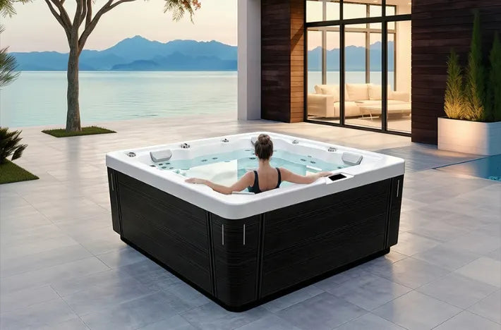 A luxury outdoor hot tub with a woman relaxing inside